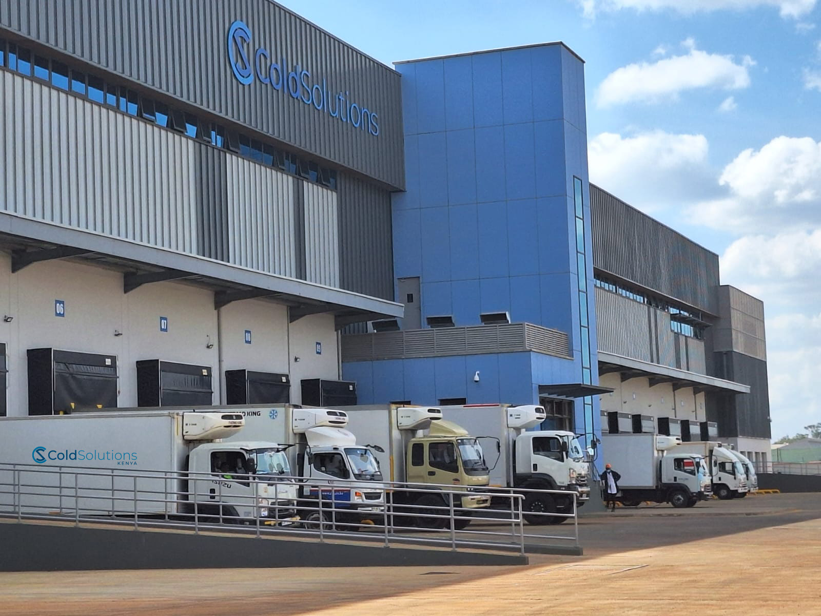Cold Solutions facility with its fleet of branded refrigerated trucks